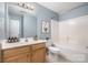 This bathroom features a white sink and vanity, and a shower and tub combo at 248 Pangle Dr, Charlotte, NC 28217