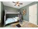 This bedroom features bunk beds, a ceiling fan and a colorful accent rug at 248 Pangle Dr, Charlotte, NC 28217