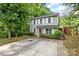 Charming two-story home with light-blue siding, white shutters, well-maintained landscaping, and a concrete driveway at 248 Pangle Dr, Charlotte, NC 28217