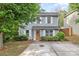 Charming two-story home with light-blue siding, white shutters, well-maintained landscaping, and a concrete driveway at 248 Pangle Dr, Charlotte, NC 28217
