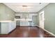 Modern kitchen with stainless steel appliances, white cabinetry, granite counters, and stylish lighting at 248 Pangle Dr, Charlotte, NC 28217