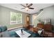 Inviting living room with hardwood floors, ceiling fan, furniture and natural light through a large window at 248 Pangle Dr, Charlotte, NC 28217