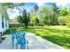 Large backyard featuring a concrete patio with outdoor furniture and a spacious, green lawn perfect for recreation at 252 S Potter Rd, Lancaster, SC 29720