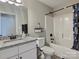 Well-lit bathroom featuring modern fixtures, granite countertop, and a shower-tub combo at 252 S Potter Rd, Lancaster, SC 29720