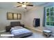 Cozy bedroom with neutral walls, a comfortable bed, and a bright window overlooking the outdoors at 252 S Potter Rd, Lancaster, SC 29720