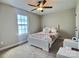 Bright bedroom with a large window, neutral walls, and carpet flooring at 252 S Potter Rd, Lancaster, SC 29720