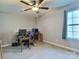 Spacious bedroom with ample natural light, wood desk, and ceiling fan at 252 S Potter Rd, Lancaster, SC 29720