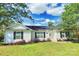 Charming single-story home with white siding, black shutters, and a well-maintained front yard with lush landscaping at 252 S Potter Rd, Lancaster, SC 29720