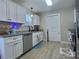 Bright kitchen with ample counter space, stainless steel appliances, and white cabinets at 252 S Potter Rd, Lancaster, SC 29720