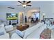 Bright living room featuring modern furnishings, wood floors and an open floor plan leading to the dining area at 252 S Potter Rd, Lancaster, SC 29720