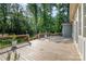 Wooden back deck and exterior with a view of the wooded backyard at 2586 Lee Lawing Rd, Lincolnton, NC 28092