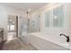 Modern bathroom features a glass-enclosed shower, soaking tub, and shiplap walls at 2586 Lee Lawing Rd, Lincolnton, NC 28092