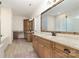 Luxurious bathroom with double vanities, granite countertops, and a large framed mirror at 2586 Lee Lawing Rd, Lincolnton, NC 28092