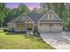 Charming home featuring a well-manicured lawn and a three-car garage at 2586 Lee Lawing Rd, Lincolnton, NC 28092