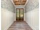Elegant foyer featuring beautiful wood ceiling and stylish wallpaper at 2586 Lee Lawing Rd, Lincolnton, NC 28092