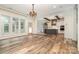 Open-concept layout connecting living room and kitchen with wood beams at 2586 Lee Lawing Rd, Lincolnton, NC 28092