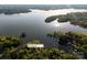 Aerial view of the property showcasing its lakeside location and lush surroundings at 264 Fairway Shores Rd, Mount Gilead, NC 27306