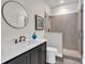 Modern bathroom with updated vanity, sink, and glass walk-in shower at 264 Fairway Shores Rd, Mount Gilead, NC 27306