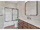 Modern bathroom with a shower-tub combo, sleek vanity, and contemporary fixtures at 264 Fairway Shores Rd, Mount Gilead, NC 27306