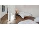 Bright bedroom featuring hardwood floors, minimalist decor, and a comfortable twin bed at 264 Fairway Shores Rd, Mount Gilead, NC 27306