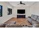 Comfortable living room with plush seating, a TV, and large windows for natural light at 264 Fairway Shores Rd, Mount Gilead, NC 27306