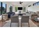 Living room with hardwood floors, neutral decor, ceiling fan and large windows with a scenic view at 264 Fairway Shores Rd, Mount Gilead, NC 27306