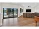 Open-concept living room featuring sliding glass doors leading to a deck with a view of the lake at 264 Fairway Shores Rd, Mount Gilead, NC 27306