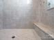 Spacious tiled shower features built-in bench at 264 Fairway Shores Rd, Mount Gilead, NC 27306