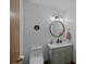 Charming half bath features a modern vanity with marble countertop and elegant decor at 300 Yacht Rd, Mooresville, NC 28117