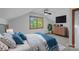 Cozy bedroom featuring an upholstered bed, neutral walls, carpet floors, and a wooden dresser at 300 Yacht Rd, Mooresville, NC 28117
