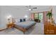 Relaxing bedroom with sliding glass doors to balcony, soft carpet, and modern furnishings at 300 Yacht Rd, Mooresville, NC 28117