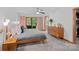 Comfortable bedroom boasts carpet, a sliding glass door to the balcony, and a dresser at 300 Yacht Rd, Mooresville, NC 28117