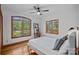 A bright bedroom featuring hardwood floors, large windows, and natural light at 300 Yacht Rd, Mooresville, NC 28117