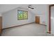Spacious room with carpet floors, neutral walls, wood trim, and a ceiling fan at 300 Yacht Rd, Mooresville, NC 28117
