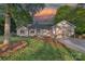 Charming single-story home boasts manicured lawn and two-car attached garage, perfect for comfortable living at 300 Yacht Rd, Mooresville, NC 28117