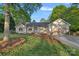Charming single-story home with an attached garage, a well-kept lawn, and neat landscaping at 300 Yacht Rd, Mooresville, NC 28117