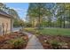 A beautifully landscaped front yard with a walkway leading to the home, surrounded by mature trees at 300 Yacht Rd, Mooresville, NC 28117