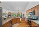 Open kitchen with wood cabinets, stone counters, stainless appliances, and seamless flow to living areas at 300 Yacht Rd, Mooresville, NC 28117