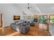 Bright living room features vaulted ceilings, a fireplace, hardwood floors, and modern furnishings at 300 Yacht Rd, Mooresville, NC 28117