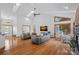 Spacious living room with high ceilings, wood floors, fireplace, and large windows for natural light at 300 Yacht Rd, Mooresville, NC 28117