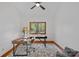 Home office features a large wooden desk, chair, and large window providing natural light at 300 Yacht Rd, Mooresville, NC 28117