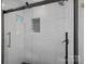 Modern shower featuring sleek subway tile, a glass enclosure, and black hardware at 300 Yacht Rd, Mooresville, NC 28117