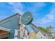 Charming blue building featuring a modern sign and colorful wall art under a clear sky at 3108 Anne St, Charlotte, NC 28205
