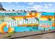 Exterior mural featuring vibrant colors and the words Midwood Plaza at 3108 Anne St, Charlotte, NC 28205