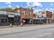 Street view of mixed-use buildings including commercial and residential properties at 3108 Anne St, Charlotte, NC 28205