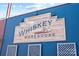 Exterior storefront sign for Whiskey Warehouse restaurant and bar at 3108 Anne St, Charlotte, NC 28205