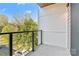 Private balcony with modern railings, perfect for relaxing and enjoying outdoor views at 3449 Byrnes St, Charlotte, NC 28205