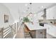 Modern kitchen with island seating, pendant lighting, and white cabinetry at 3449 Byrnes St, Charlotte, NC 28205
