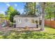 Landscaped backyard with a shed, swing set, and well-maintained lawn for outdoor enjoyment at 3831 Robeson Creek Dr, Charlotte, NC 28270