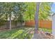 A private backyard with a wooden fence and mature trees at 3831 Robeson Creek Dr, Charlotte, NC 28270